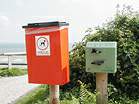 Dog waste bags and bin in Middle Beach car park  Studland United Nudists